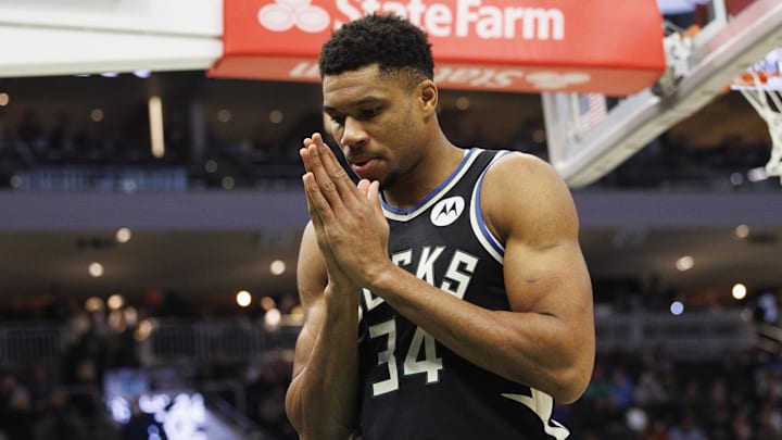 Giannis says a prayer before a game. 