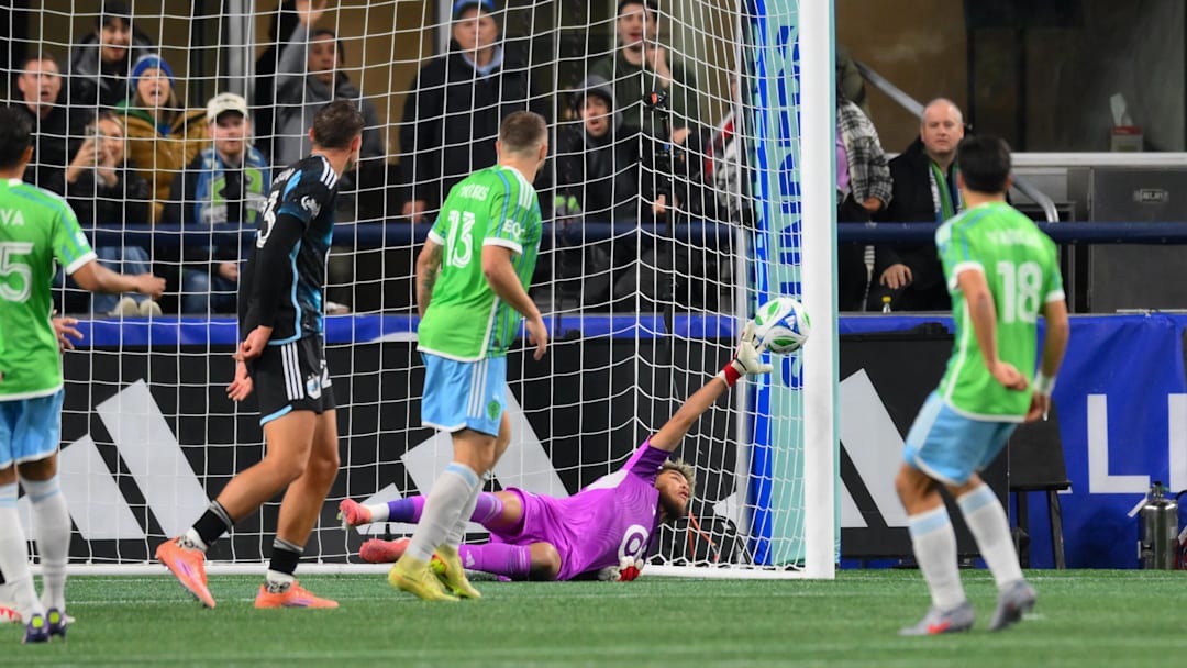 Nov 3, 2025; Seattle, Washington, USA; Minnesota United goalkeeper Dayne St. Clair (97) misses a goal shot by Seattle Sounders FC midfielder Obed Vargas (18) during the second half at Lumen Field. Mandatory Credit: Steven Bisig-Imagn Images
