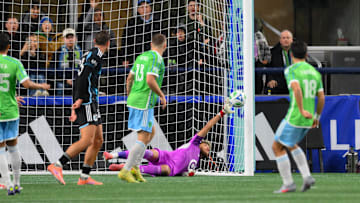 Nov 3, 2025; Seattle, Washington, USA; Minnesota United goalkeeper Dayne St. Clair (97) misses a goal shot by Seattle Sounders FC midfielder Obed Vargas (18) during the second half at Lumen Field. Mandatory Credit: Steven Bisig-Imagn Images