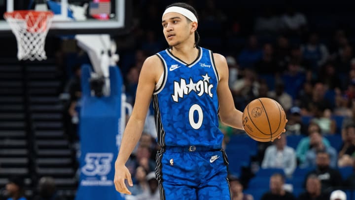 Mar 13, 2024; Orlando, Florida, USA; Orlando Magic guard Anthony Black (0) dribbles the ball against the Brooklyn Nets in the fourth quarter at Kia Center. Mandatory Credit: Jeremy Reper-USA TODAY Sports