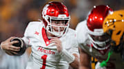 Houston Cougars quarterback Conner Weigman (1) scrambles with the ball as they play against the ASU Sun Devils at Mountain America Stadium in Tempe on Oct. 25, 2025.