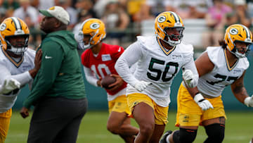 Green Bay Packers offensive tackle Zach Tom (50) runs through a drill during the first day of training camp on Wednesday, July 23, 2025, at Ray Nitschke Field in Ashwaubenon, Wis. 
Tork Mason/USA TODAY NETWORK-Wisconsin