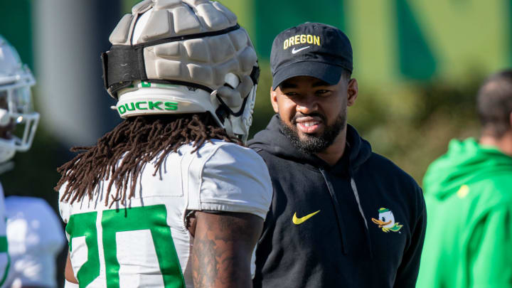 New Oregon running backs coach Ra’Shaad Samples talks with running back Jordan James during practice with the Oregon Ducks Tuesday, April 9, 2024, at the Hatfield-Dowlin Complex in Eugene, Ore.