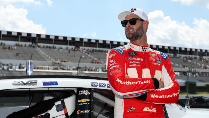 Jul 13, 2024; Long Pond, Pennsylvania, USA; NASCAR Xfinity Series driver Shane Van Gisbergen stands on pit road prior to the Explore The Pocono Mountains 225 at Pocono Raceway. Photo Credit