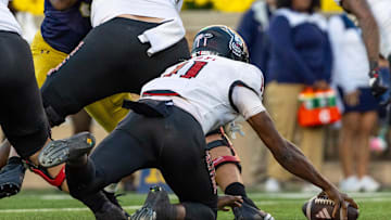Oct 11, 2025; South Bend, Indiana, USA; NC State Wolfpack quarterback CJ Bailey (11) fumbles a snap in the end zone for a safety against the Notre Dame Fighting Irish during the second half at Notre Dame Stadium. Mandatory Credit: Michael Caterina-Imagn Images
