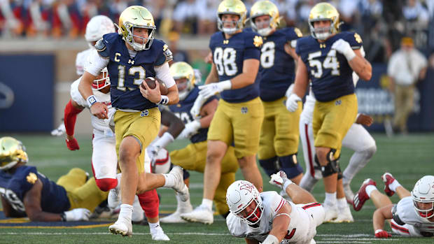 Riley Leonard breaks a long run against Miami in Septembe