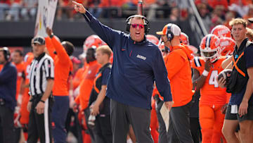 Illinois Fighting Illini head coach Bret Bielema motions during the first half of the NCAA football game against the Ohio State Buckeyes at Gies Memorial Stadium in Champaign on Oct. 11, 2025.