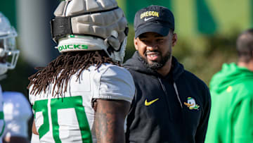 New Oregon running backs coach Ra’Shaad Samples talks with running back Jordan James during practice with the Oregon Ducks on Tuesday, April 9, 2024, at the Hatfield-Dowlin Complex in Eugene, Ore.