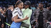 Jun 10, 2025; Chicago Sky forward Angel Reese talks with WNBA legend Lisa Leslie following the game against the New York Liberty.