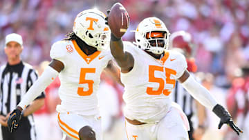 Tennessee defensive lineman Omarr Norman-Lott (55) and defensive back Kamal Hadden (5) celebrate after recovering an Alabama fumble during a football game between Tennessee and Alabama at Bryant-Denny Stadium in Tuscaloosa, Ala., on Saturday, Oct. 21, 2023.