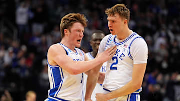 Mar 27, 2025; Newark, NJ, USA; Duke basketball forward Cooper Flagg (2) reacts after making a last second shot to end the first half against the Arizona Wildcats during an East Regional semifinal of the 2025 NCAA tournament at Prudential Center.