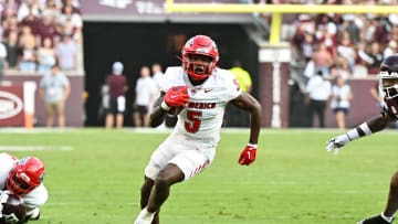 Sep 2, 2023; College Station, Texas, USA; New Mexico Lobos running back Jacory Croskey-Merritt (5) runs the ball during the first half against the Texas A&M Aggies at Kyle Field. Mandatory Credit: Maria Lysaker-USA TODAY Sports
