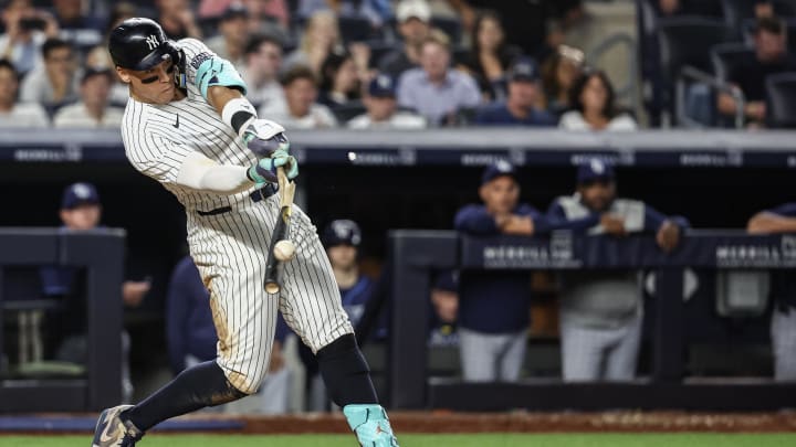 Jul 19, 2024; Bronx, New York, USA;  New York Yankees designated hitter Aaron Judge (99) hits an RBI single in the sixth inning against the Tampa Bay Rays at Yankee Stadium. Mandatory Credit: Wendell Cruz-USA TODAY Sports