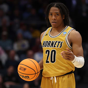 Mar 18, 2025; Dayton, OH, USA; Alabama State Hornets guard TJ Madlock (20) moves the ball in the second half against the St. Francis (Pa) Red Flash at UD Arena. Mandatory Credit: Rick Osentoski-Imagn Images