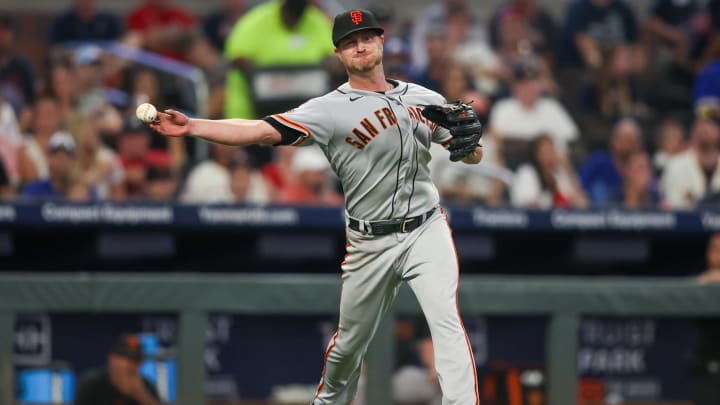 Aug 18, 2023; Atlanta, Georgia, USA; San Francisco Giants starting pitcher Alex Cobb (38) throws a runner out at first against the Atlanta Braves in the sixth inning at Truist Park. Mandatory Credit: Brett Davis-USA TODAY Sports