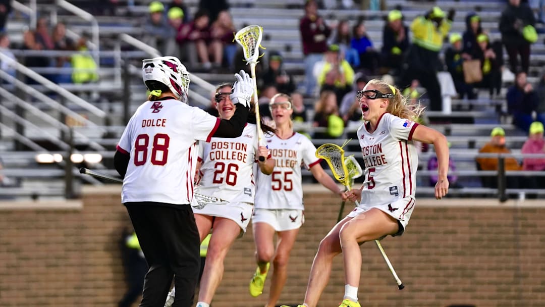Boston College players celebrate with Shea Dolce after a win at Alumni Stadium on April 16, 2026.
