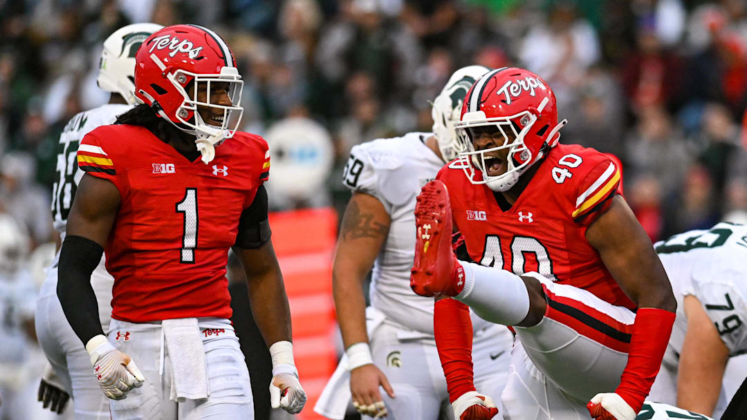 Oct 1, 2022; College Park, Maryland, USA;  Maryland Terrapins defensive lineman Taizse Johnson (40) celebrates with linebacker Jaishawn Barham (1) during the second half against the Michigan State Spartans at Capital One Field at Maryland Stadium. Mandatory Credit: Tommy Gilligan-Imagn Images