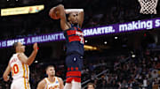Nov 25, 2025; Washington, District of Columbia, USA; Washington Wizards center Alex Sarr (20) dunks the ball as Atlanta Hawks forward Zaccharie Risacher (10) looks on in the second half at Capital One Arena. Mandatory Credit: Geoff Burke-Imagn Images