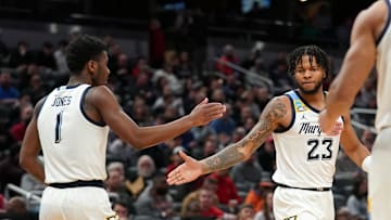 Mar 22, 2024; Indianapolis, IN, USA; Marquette Golden Eagles forward David Joplin (23) and guard Kam Jones (1) react in the second half against the Western Kentucky Hilltoppers in the first round of the 2024 NCAA Tournament at Gainbridge FieldHouse. Mandatory Credit: Robert Goddin-Imagn Images
