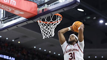 Feb 19, 2025; Auburn, Alabama, USA;  Auburn Tigers forward Chaney Johnson (31) goes for a dunk against the Arkansas Razorbacks during the second half at Neville Arena. Mandatory Credit: John Reed-Imagn Images