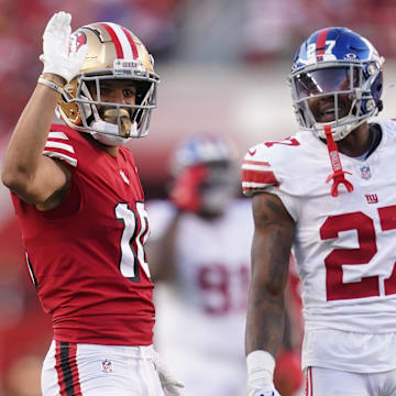 Sep 21, 2023; Santa Clara, California, USA; San Francisco 49ers wide receiver Ronnie Bell (10) gestures after making a catch for a first down in front of New York Giants safety Jason Pinnock (27) in the second quarter at Levi's Stadium. Mandatory Credit: Cary Edmondson-Imagn Images