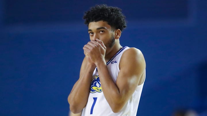 Delaware's Izaiah Pasha warms his hands as the Blue Hens get underway against Monmouth in the first half at the Bob Carpenter Center in Newark, Del., Saturday, Jan. 4, 2025.