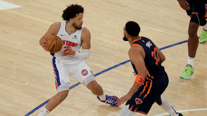 Apr 21, 2025; New York, New York, USA; Detroit Pistons guard Cade Cunningham (2) controls the ball against New York Knicks center Karl-Anthony Towns (32) during the first quarter of game two of first round of the 2024 NBA Playoffs at Madison Square Garden. Mandatory Credit: Brad Penner-Imagn Images