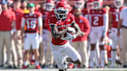 Oct 22, 2022; Piscataway, New Jersey, USA; Rutgers Scarlet Knights wide receiver Aron Cruickshank (1) carries the ball against the Indiana Hoosiers during the second half at SHI Stadium. Mandatory Credit: Vincent Carchietta-Imagn Images