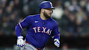May 23, 2025; Chicago, Illinois, USA; Texas Rangers first baseman Jake Burger (21) runs after hitting an RBI-double against the Chicago White Sox during the sixth inning at Rate Field