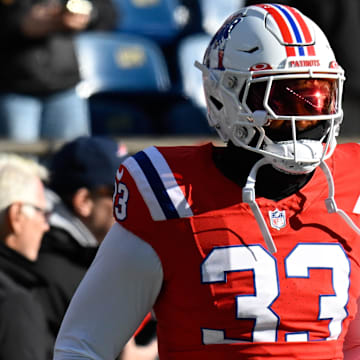 Dec 1, 2024; Foxborough, Massachusetts, USA; New England Patriots linebacker Anfernee Jennings (33) warms up before a game against the Indianapolis Colts at Gillette Stadium. Mandatory Credit: Eric Canha-Imagn Images