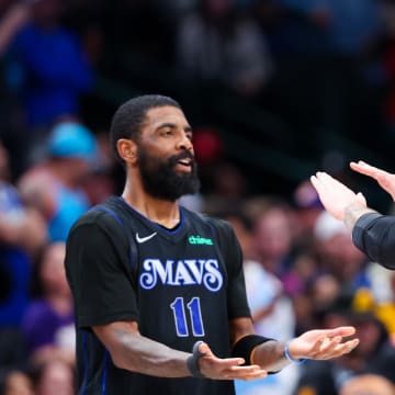 Feb 22, 2024; Dallas, Texas, USA;  Dallas Mavericks guard Kyrie Irving (11) celebrates with Dallas Mavericks guard Luka Doncic (77) during the second half against the Phoenix Suns at American Airlines Center. Mandatory Credit: Kevin Jairaj-USA TODAY Sports