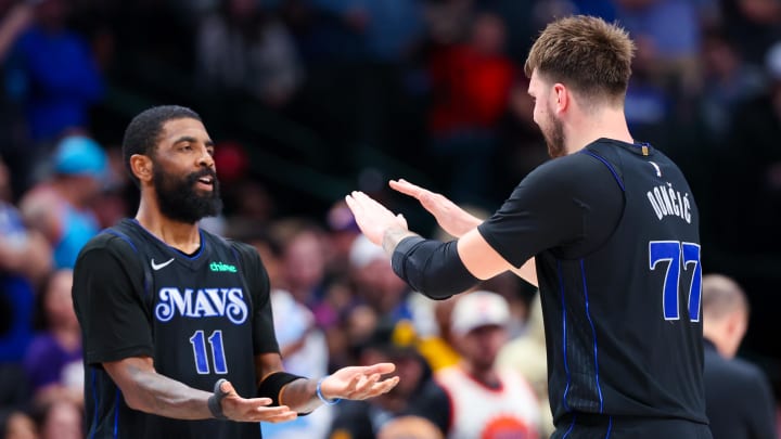 Feb 22, 2024; Dallas, Texas, USA;  Dallas Mavericks guard Kyrie Irving (11) celebrates with Dallas Mavericks guard Luka Doncic (77) during the second half against the Phoenix Suns at American Airlines Center. Mandatory Credit: Kevin Jairaj-USA TODAY Sports