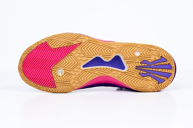 The purple and tan outsole of Kyrie Irving's shoe.