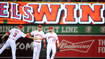 September 30, 2016; Anaheim, CA, USA; Los Angeles Angels left fielder Nick Buss (3), center fielder Rafael Ortega (39) and right fielder Shane Robinson (17) celebrate the 7-1 victory against the Houston Astros at Angel Stadium of Anaheim. Mandatory Credit: Gary A. Vasquez-Imagn Images