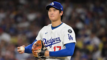 Sep 16, 2025; Los Angeles, California, USA; Los Angeles Dodgers two-way player Shohei Ohtani (17) smiles as he pitches to former teammate Philadelphia Phillies center fielder Brandon Marsh (16) during the fourth inning at Dodger Stadium. Mandatory Credit: Jayne Kamin-Oncea-Imagn Images