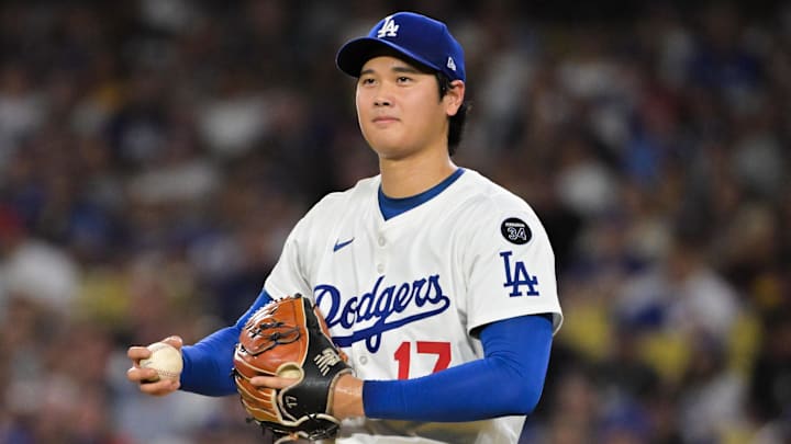 Sep 16, 2025; Los Angeles, California, USA; Los Angeles Dodgers two-way player Shohei Ohtani (17) smiles as he pitches to former teammate Philadelphia Phillies center fielder Brandon Marsh (16) during the fourth inning at Dodger Stadium. Mandatory Credit: Jayne Kamin-Oncea-Imagn Images