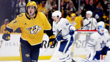 Mar 22, 2025; Nashville, Tennessee, USA; Nashville Predators right wing Luke Evangelista (77) celebrates after scoring a goal during the third period of their game against the Toronto Maple Leafs at Bridgestone Arena. Mandatory Credit: Alan Poizner-Imagn Images