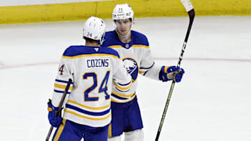 Oct 19, 2024; Chicago, Illinois, USA;  Buffalo Sabres center Ryan McLeod (71) celebrates with center Dylan Cozens (24) after an empty net goal against the Chicago Blackhawks during the third period at the United Center. Mandatory Credit: Matt Marton-Imagn Images