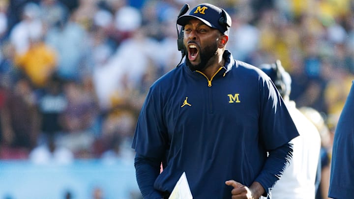 Dec 31, 2024; Tampa, FL, USA; Michigan Wolverines head coach Sherrone Moore screams from the sideline against the Alabama Crimson Tide during the second half at Raymond James Stadium. Mandatory Credit: Matt Pendleton-Imagn Images