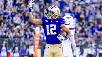 Sep 21, 2024; Seattle, Washington, USA; Washington Huskies wide receiver Denzel Boston (12) celebrates after catching a touchdown pass against the Northwestern Wildcats during the second quarter at Alaska Airlines Field at Husky Stadium. Mandatory Credit: Joe Nicholson-Imagn Images