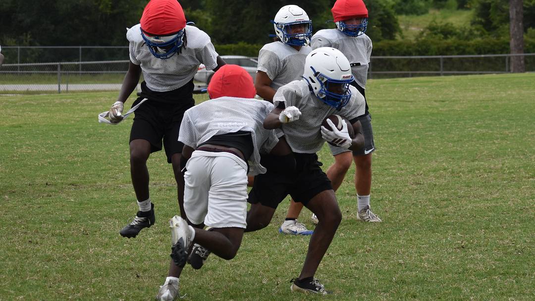 Deltona's Naz Thomas breaks loose for a big gain during Wednesday drills at Deltona High. Thomas is one of four outstanding running backs for the Wolves, whose goal is to make history this season and win a first district title.