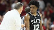 Mississippi State Bulldogs head coach Chris Jans talks to guard Josh Hubbard (12) during the first half against the Arkansas Razorbacks at Bud Walton Arena. 