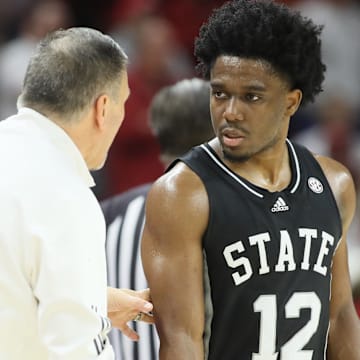Mississippi State Bulldogs head coach Chris Jans talks to guard Josh Hubbard (12) during the first half against the Arkansas Razorbacks at Bud Walton Arena. 
