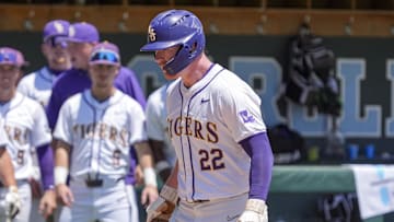 May 31, 2024; Chapel Hill, NC, USA; LSU first baseman Jared Jones (22) trots onto home plate after hitting the tying home run against the Wofford Terriers during the NCAA Regional in Chapel Hill. Mandatory Credit: Jim Dedmon-Imagn Images
