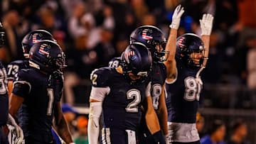 Nov 8, 2025; East Hartford, Connecticut, USA; UConn Huskies quarterback Joe Fagnano (2) with teammates after running the ball for a two point conversion against the Duke Blue Devils in the second half at Pratt & Whitney Stadium at Rentschler Field. Mandatory Credit: David Butler II-Imagn Images