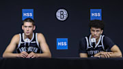 Sep 23, 2025; Brooklyn, NY, USA;  Brooklyn Nets guards Egor Demin (8) and Nolan Traore (88) speak at Media Day. Mandatory Credit: Wendell Cruz-Imagn Images