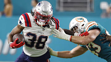 Miami Dolphins linebacker Andrew Van Ginkel (43) tackles New England Patriots running back Rhamondre Stevenson (38) during the third quarter at Hard Rock Stadium.