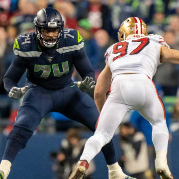 December 29, 2019; Seattle, Washington, USA; Seattle Seahawks offensive tackle George Fant (74) against San Francisco 49ers defensive end Nick Bosa (97) during the fourth quarter at CenturyLink Field.
