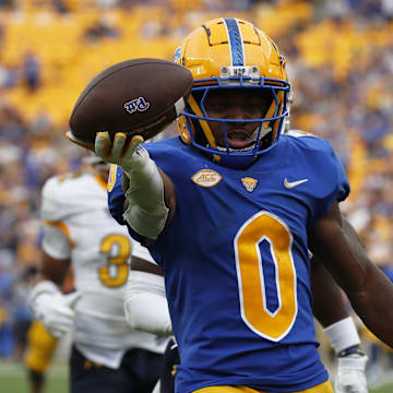 Aug 31, 2024; Pittsburgh, Pennsylvania, USA;  Pittsburgh Panthers running back Desmond Reid (0) runs on his way to scoring a touchdown against the Kent State Golden Flashes during the third quarter at Acrisure Stadium. Pittsburgh won 55-24. Mandatory Credit: Charles LeClaire-Imagn Images