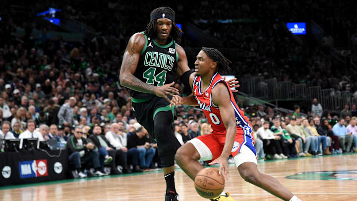 May 1, 2023; Boston, Massachusetts, USA; Philadelphia 76ers guard Tyrese Maxey (0) controls the ball while Boston Celtics center Robert Williams III (44) defends in the first half during game one of the 2023 NBA playoffs at TD Garden. Mandatory Credit: Bob DeChiara-Imagn Images